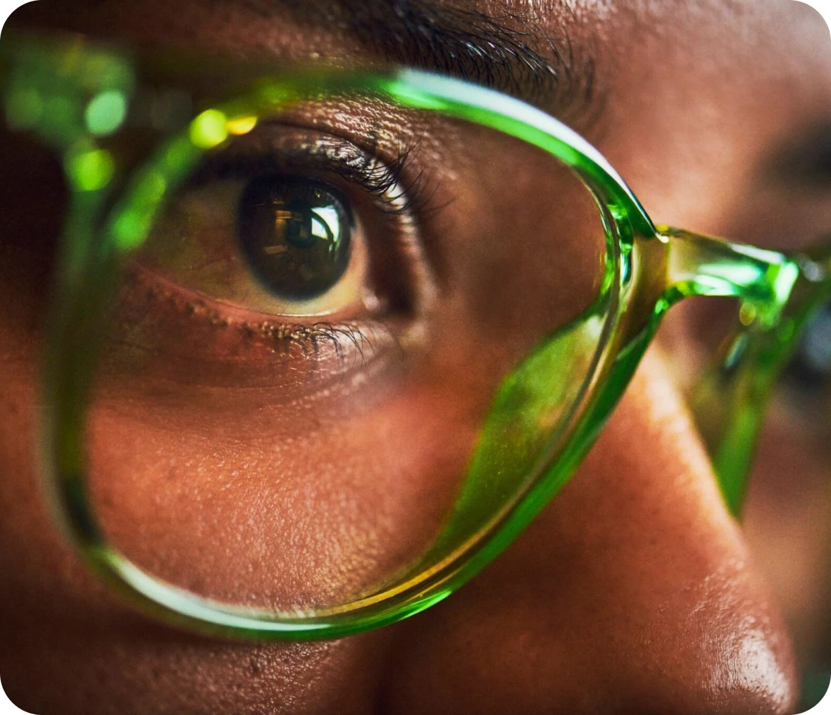 Close-up of eye with green glasses