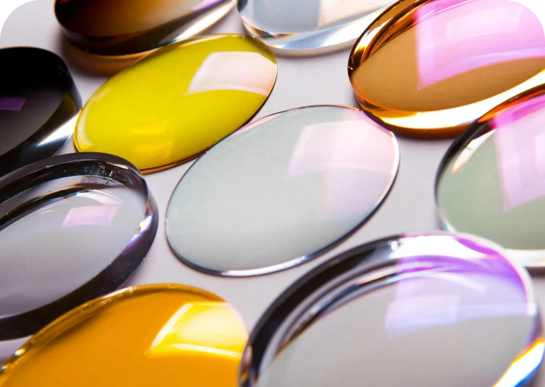 Colorful glass lenses on white background